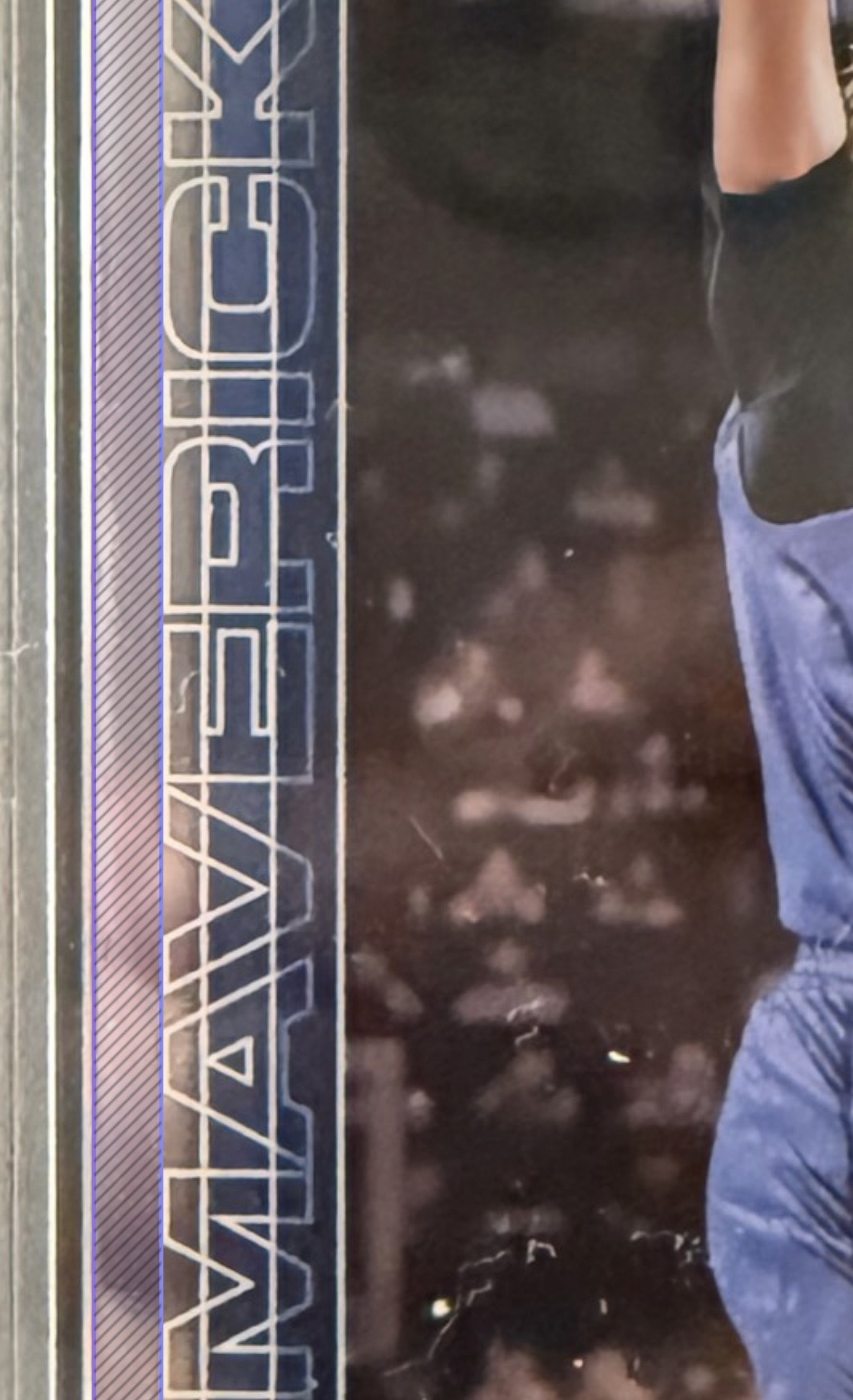 Zoomed view of the left edge of a 2025 Topps Chrome card. A purple stripe marks the distance from the outer card edge to the team name text.
